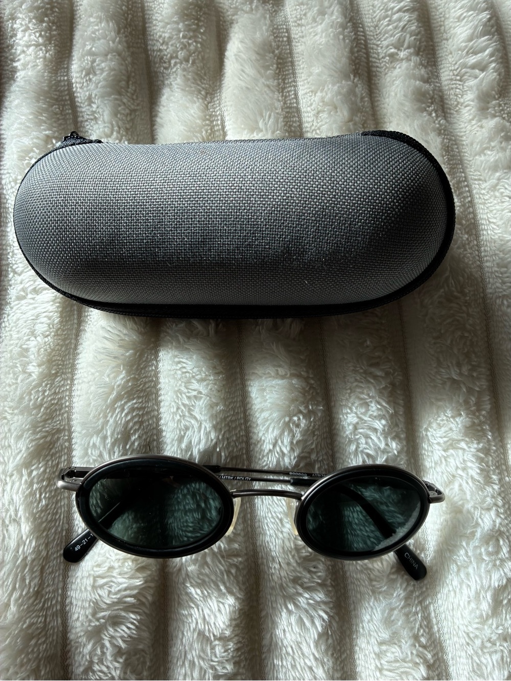 Oliver People Classic Oval Dark Lens Sunglasses with Gray Textured Case
